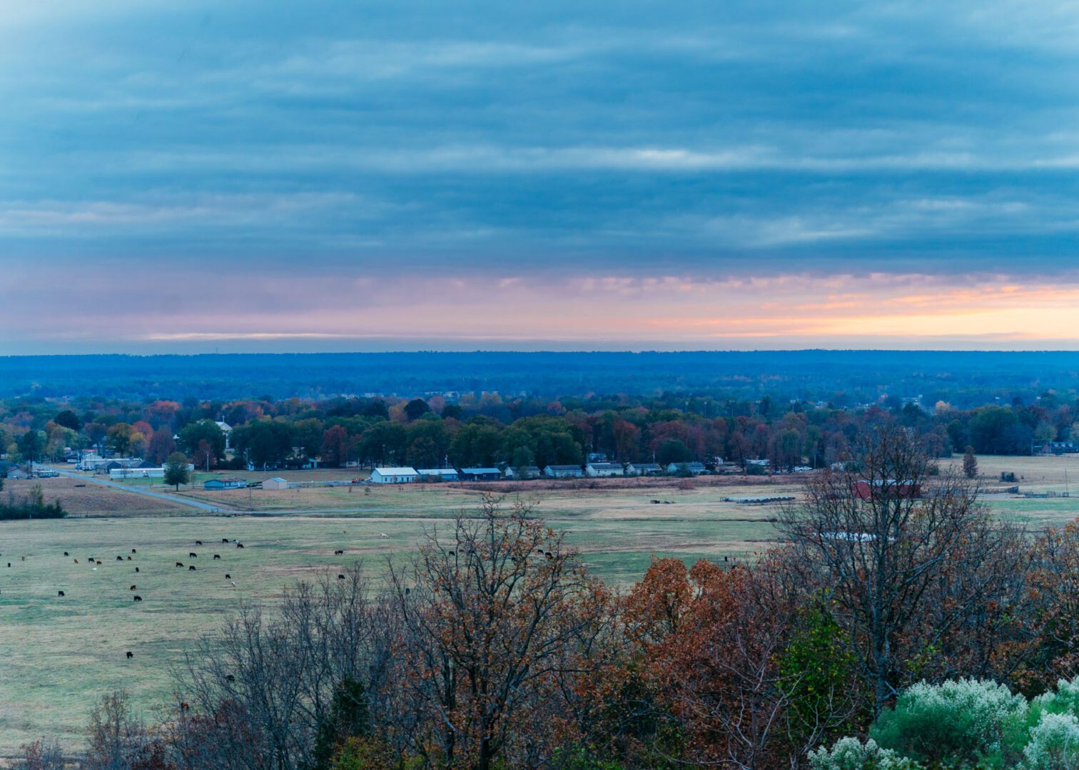 A view of the countryside from above at dusk.